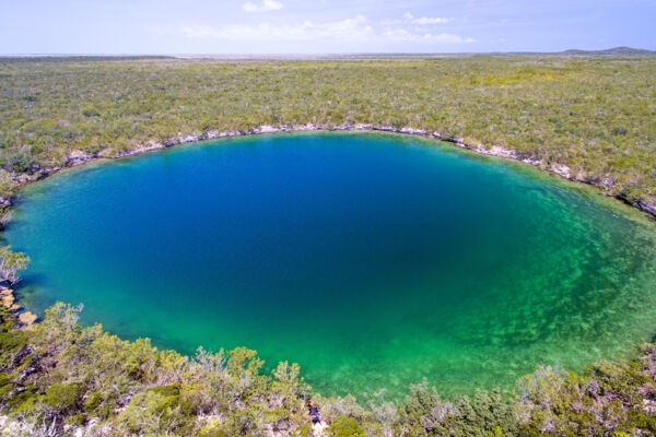 Aerial view of giant saline Karst blue hole on East Caicos