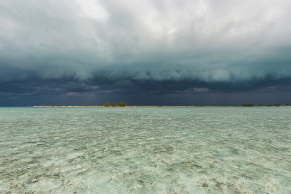 Storm clouds over Water Cay and Little Water Cay