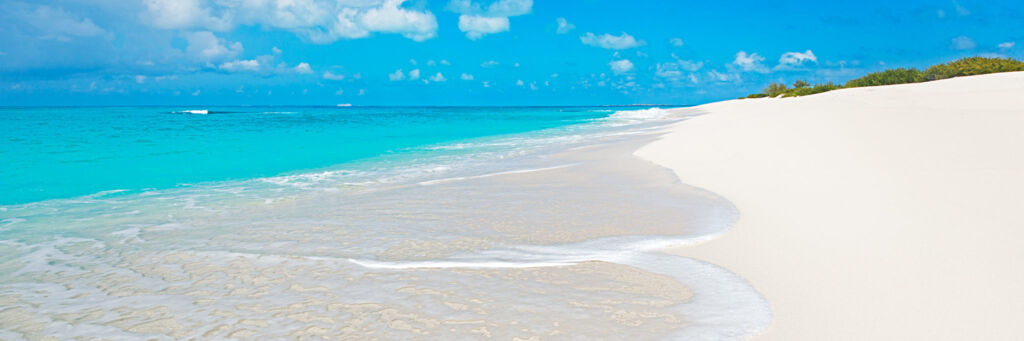 Waves washing onto the sands of North Bay Beach, Salt Cay.