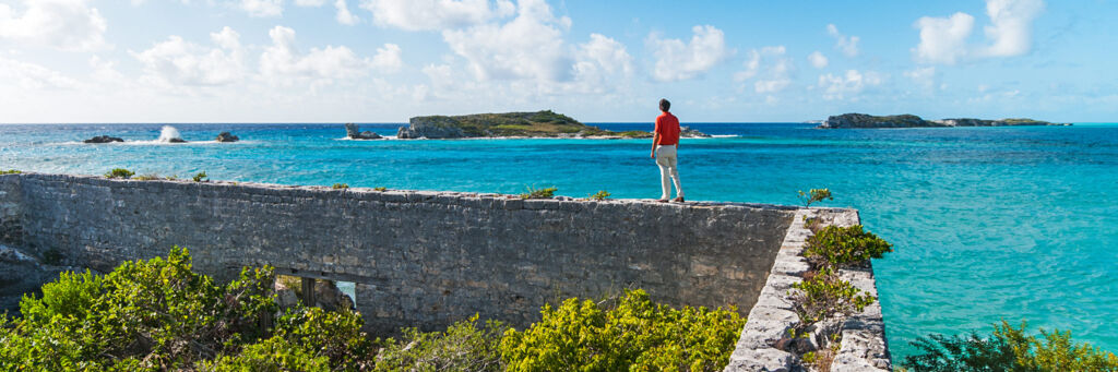 The foundation of a colonial building and the view of Long Cay from South Caicos