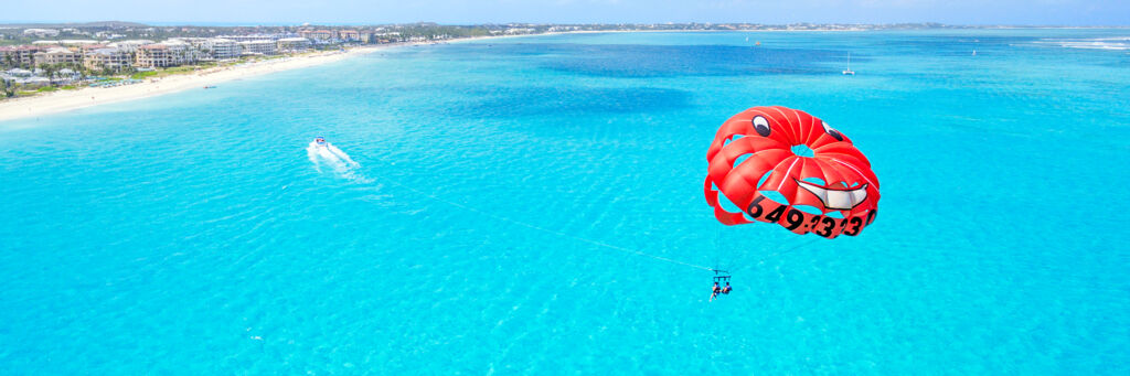 Parasailing off Grace Bay Beach at Providenciales