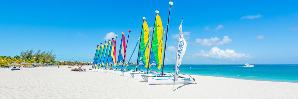 Hobie Cat sailboats on the wide white sand beach fronting Club Med