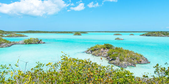 Turquoise water and small islands in Chalk Sound 