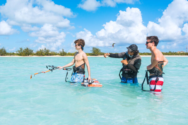 Kiteboarding lessons in the shallow turquoise water at Long Bay Beach