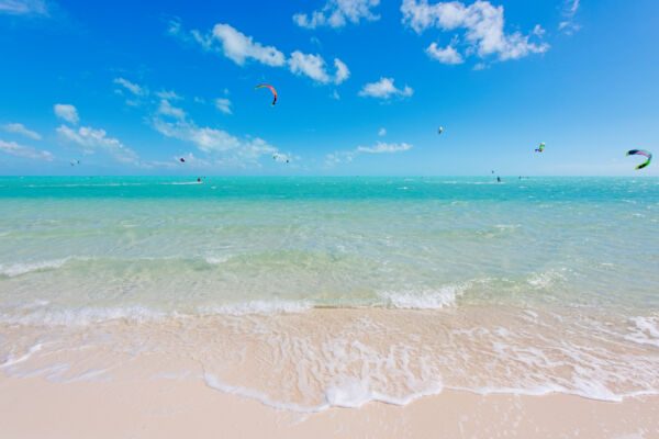 Beautiful turquoise water and kiteboarders at Long Bay Beach in the Turks and Caicos